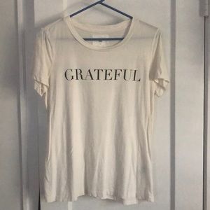 Graphic T-shirt, off white with black lettering. Size small